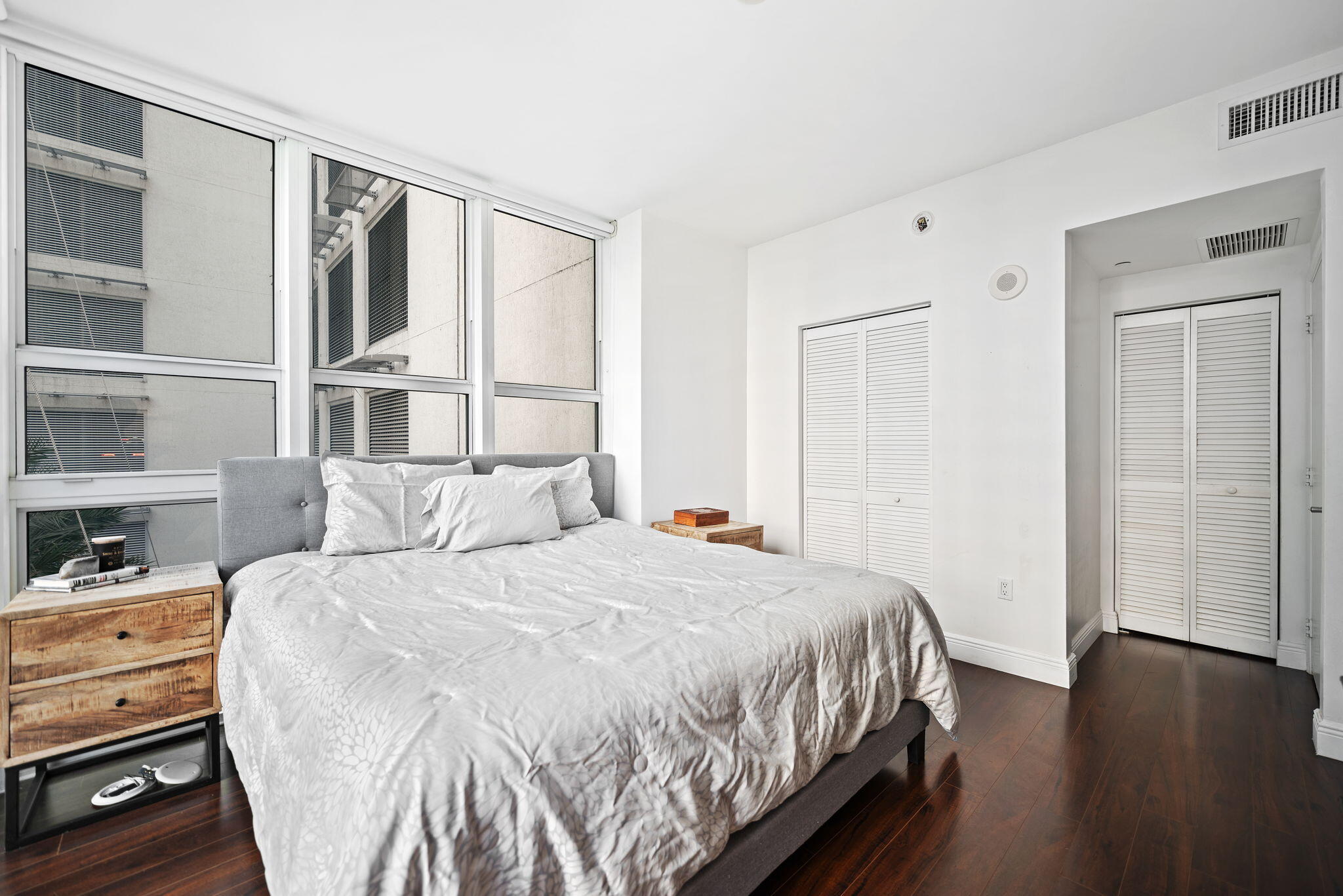 951 Brickell Avenue, Unit 400 Miami, FL 33131 - Photo 21 of 40 a bedroom with a bed and a window