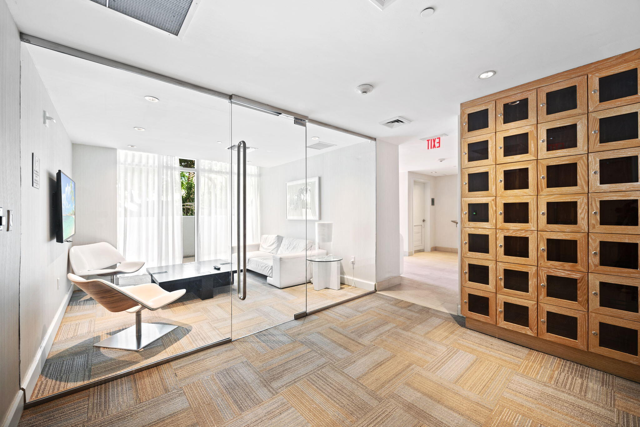 951 Brickell Avenue, Unit 400 Miami, FL 33131 - Photo 31 of 40 a living room with a black white checkered floor with a gaming machine and a chair