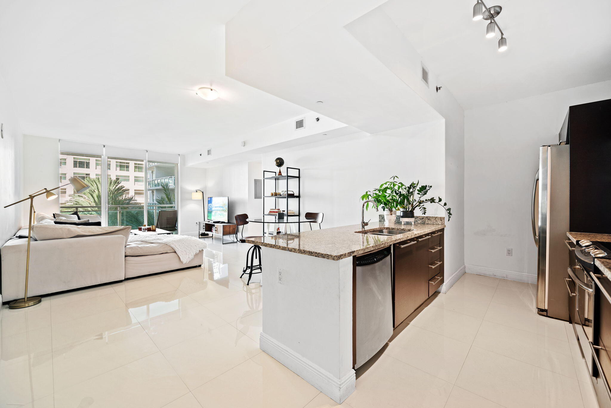 951 Brickell Avenue, Unit 400 Miami, FL 33131 - Photo 7 of 40 a view of living room with furniture and flat screen tv