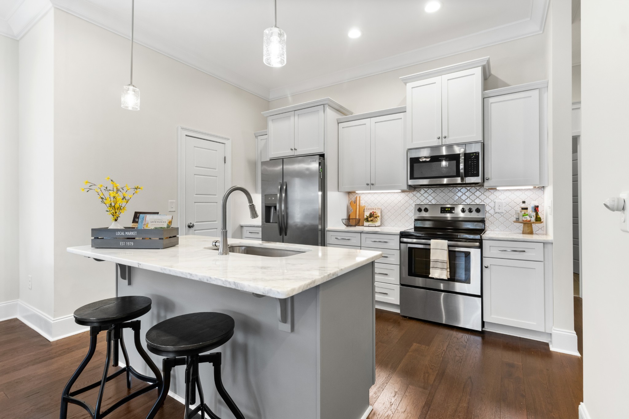 725 Centre Street Pleasant View, TN 37146 - Photo 14 of 44 a kitchen with stainless steel appliances kitchen island a refrigerator and a stove top oven