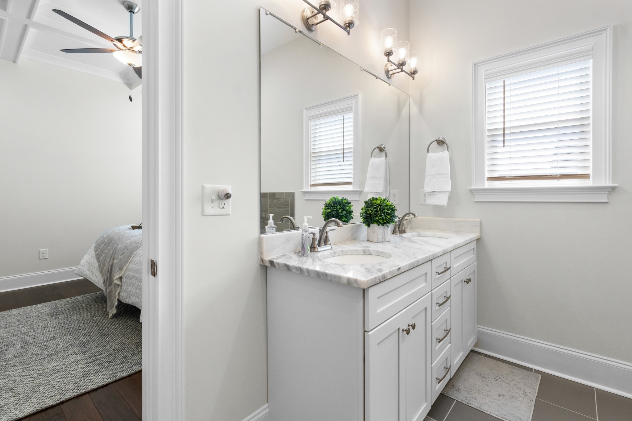 725 Centre Street Pleasant View, TN 37146 - Photo 21 of 44 a bathroom with a granite countertop sink and a mirror