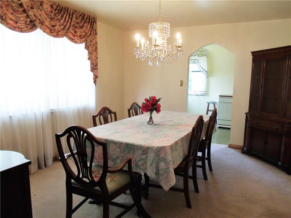 2103 Ridge Road Jeannette, PA 15644 - Photo 5 of 19 Formal diningroom with large window overlooking side yard, crystal chandelier and hardwood under carpeting.