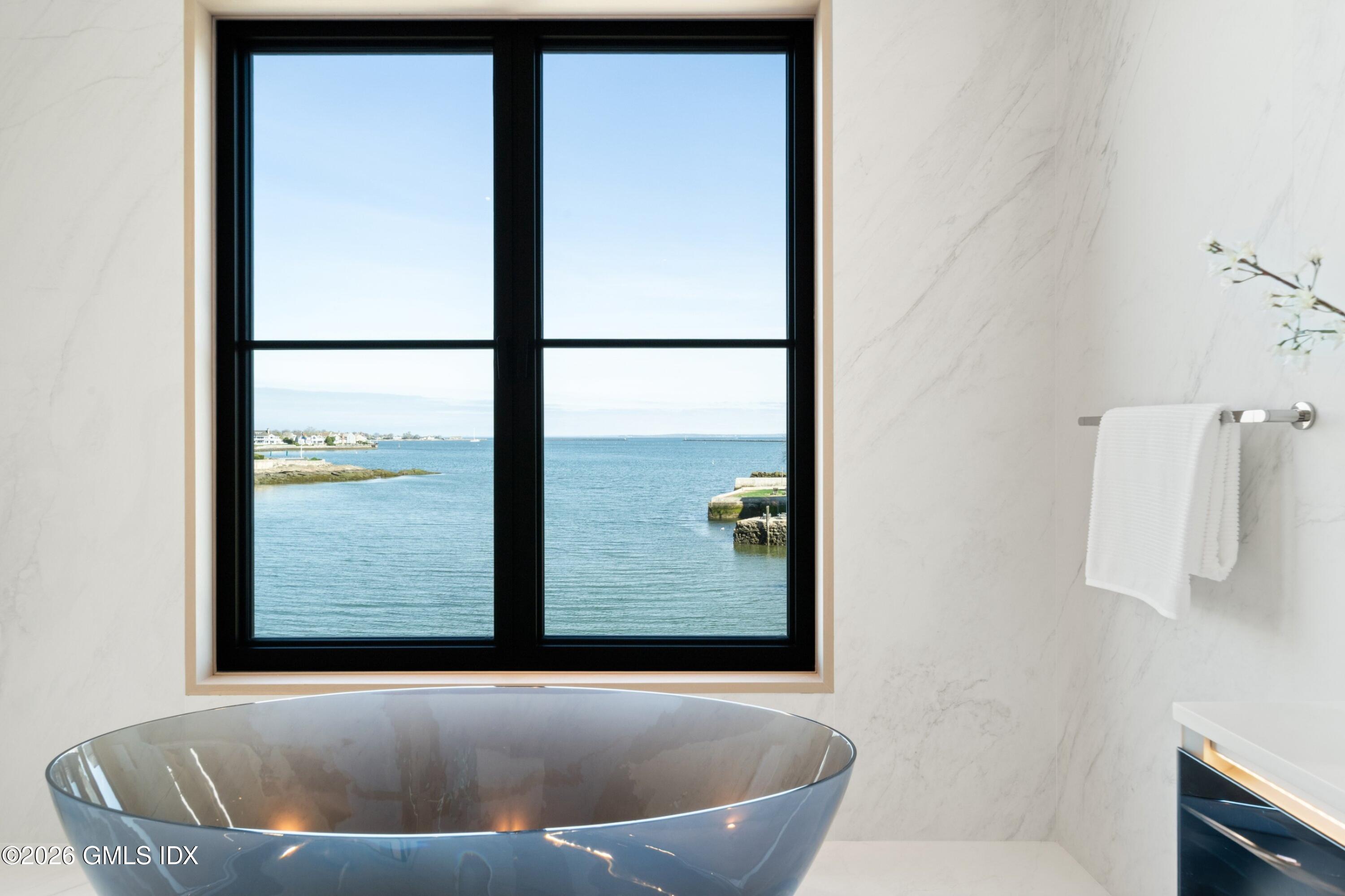 58 Shore Road Old Greenwich, CT 06870 - Photo 41 of 86 a view of a bathtub in a room