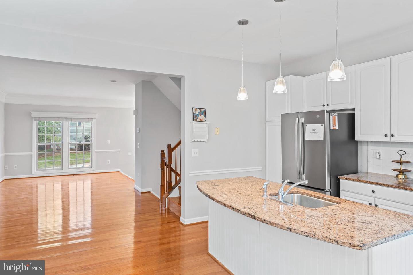 19893 Upland Terrace Ashburn, VA 20147 - Photo 11 of 29 a kitchen with stainless steel appliances granite countertop a sink a stove and a refrigerator