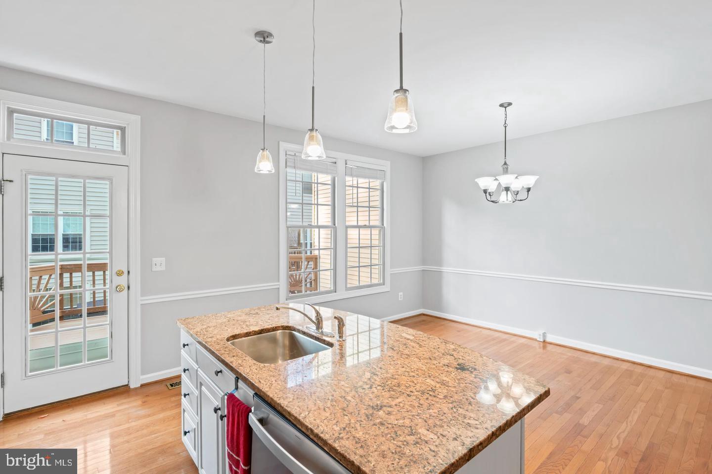 19893 Upland Terrace Ashburn, VA 20147 - Photo 16 of 29 a kitchen with stainless steel appliances granite countertop a sink a oven a counter space and a window