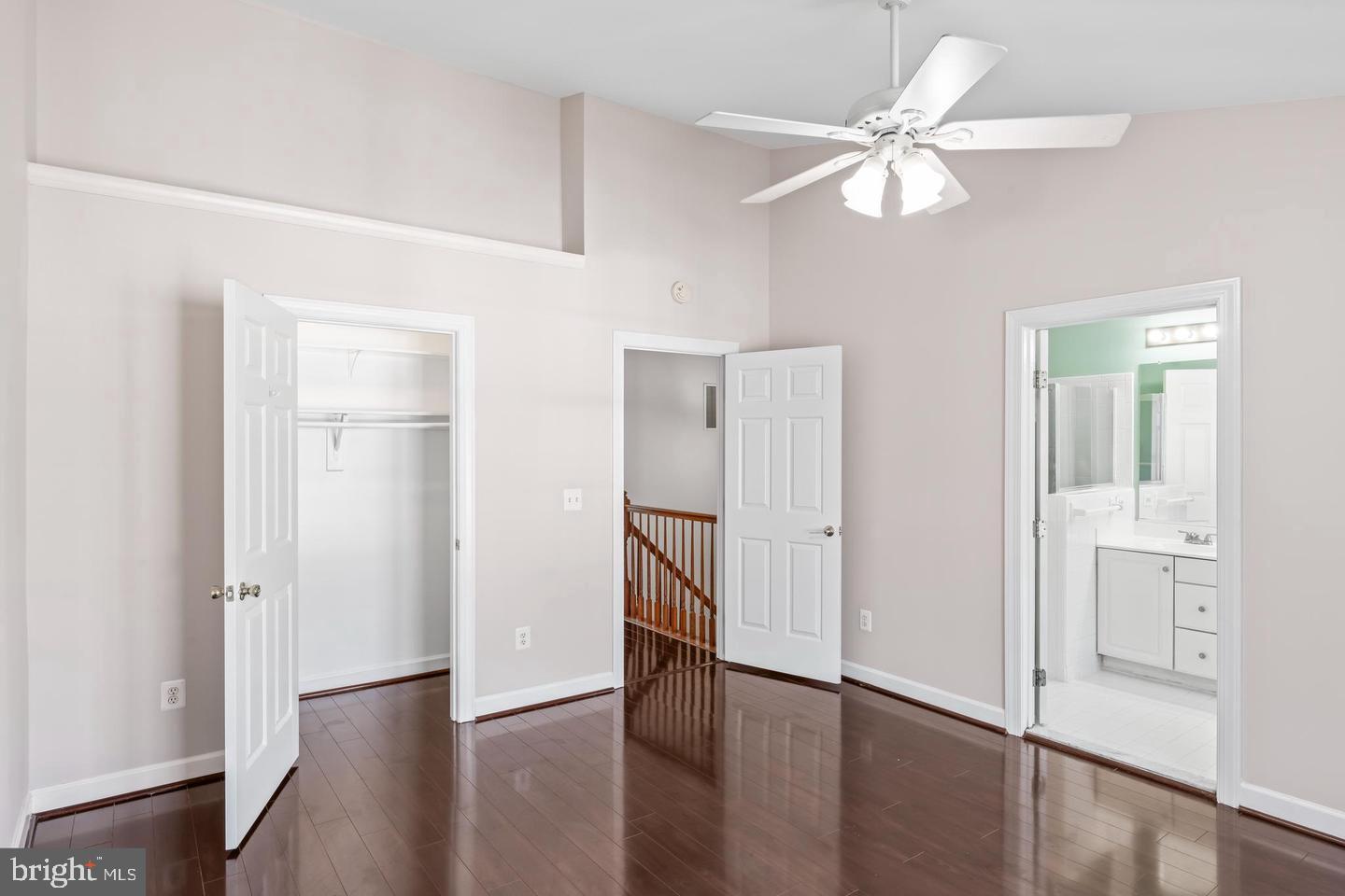 19893 Upland Terrace Ashburn, VA 20147 - Photo 22 of 29 an empty room with wooden floor closet and windows