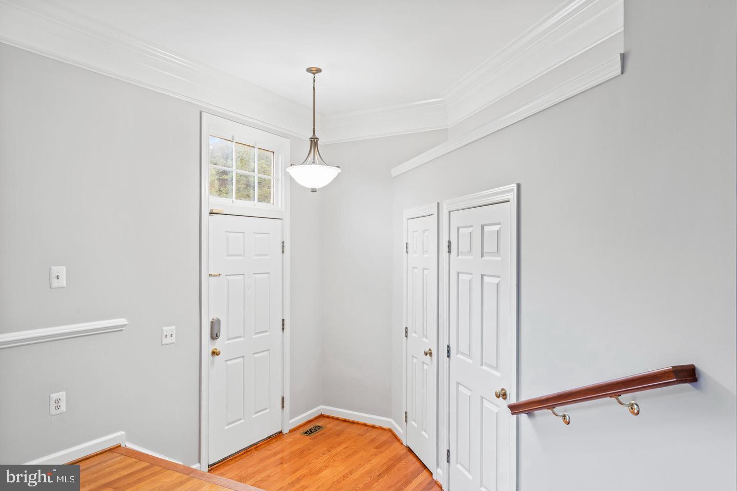 19893 Upland Terrace Ashburn, VA 20147 - Photo 3 of 29 a view of a room with cabinet wooden floor and windows