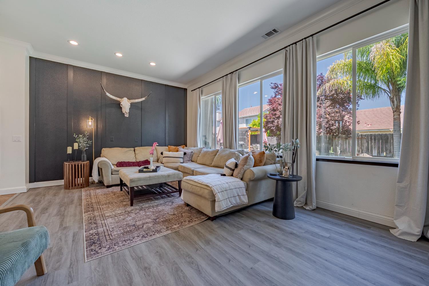 1833 La Quinta Court Merced, CA 95340 - Photo 13 of 55 a living room with furniture and large windows