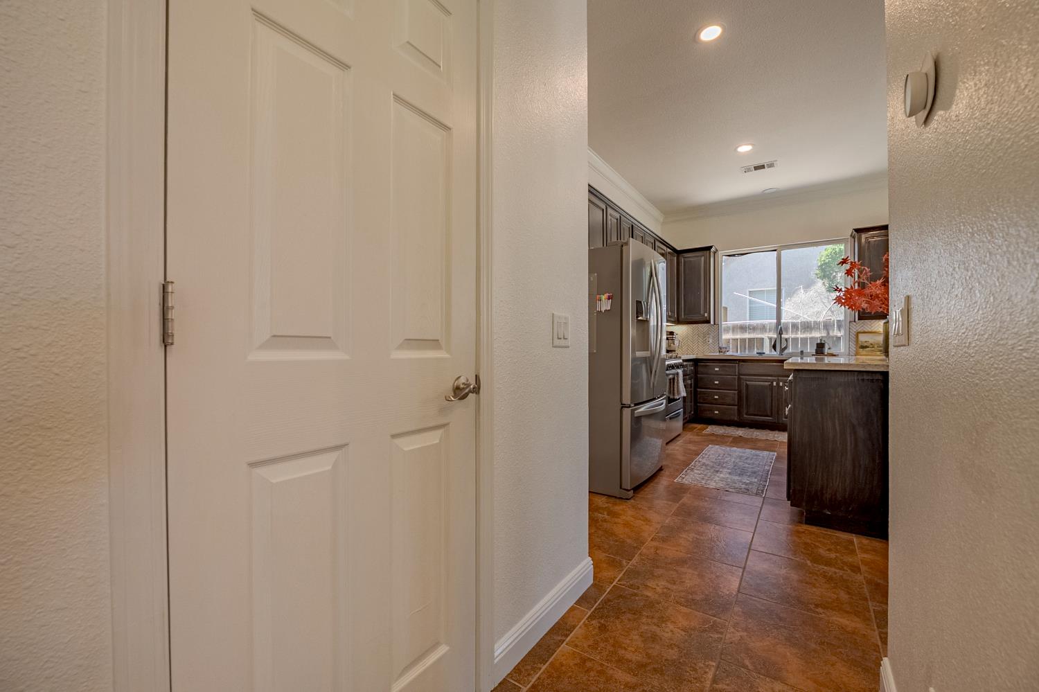 1833 La Quinta Court Merced, CA 95340 - Photo 16 of 55 a kitchen with a refrigerator and a sink