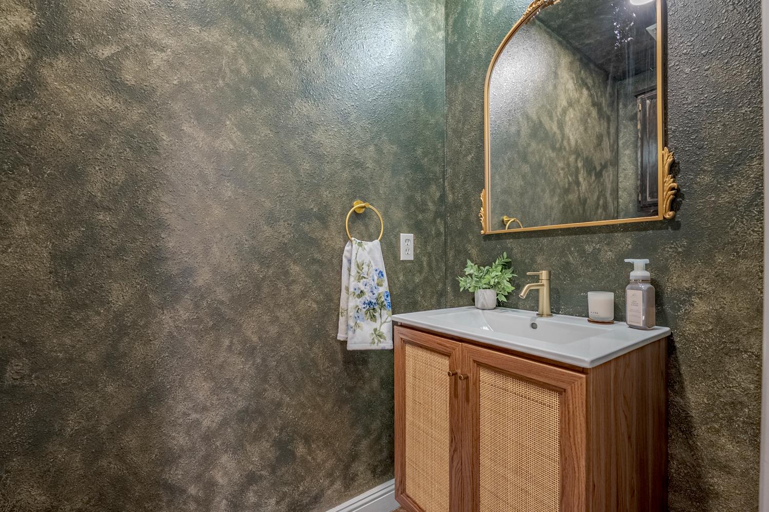 1833 La Quinta Court Merced, CA 95340 - Photo 18 of 55 a bathroom with a sink and a mirror