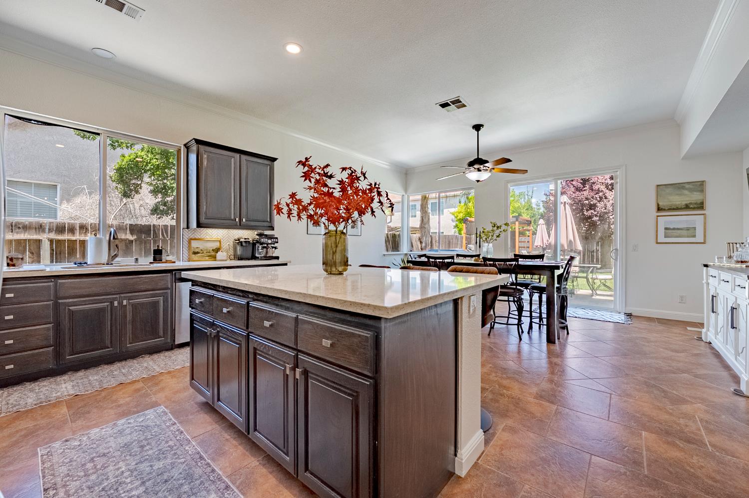 1833 La Quinta Court Merced, CA 95340 - Photo 19 of 55 a kitchen with granite countertop a sink cabinets and window