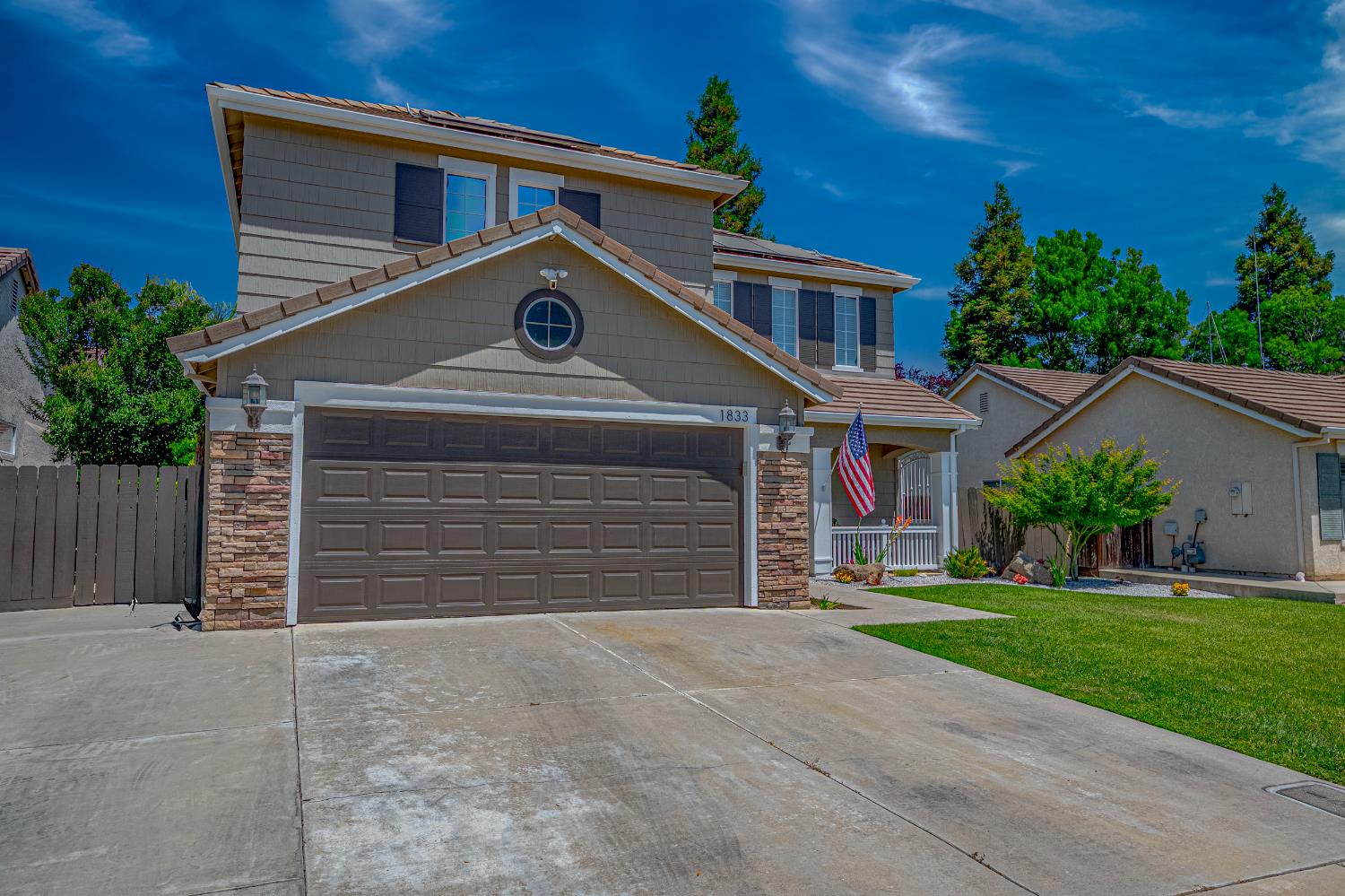 1833 La Quinta Court Merced, CA 95340 - Photo 2 of 55 front view of a house with a yard
