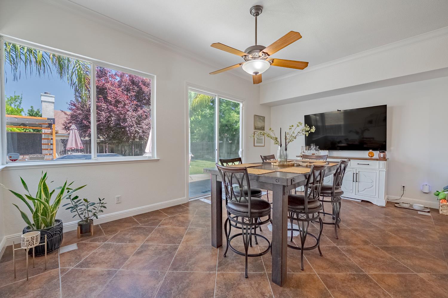 1833 La Quinta Court Merced, CA 95340 - Photo 22 of 55 a view of a dining room with furniture window and wooden floor