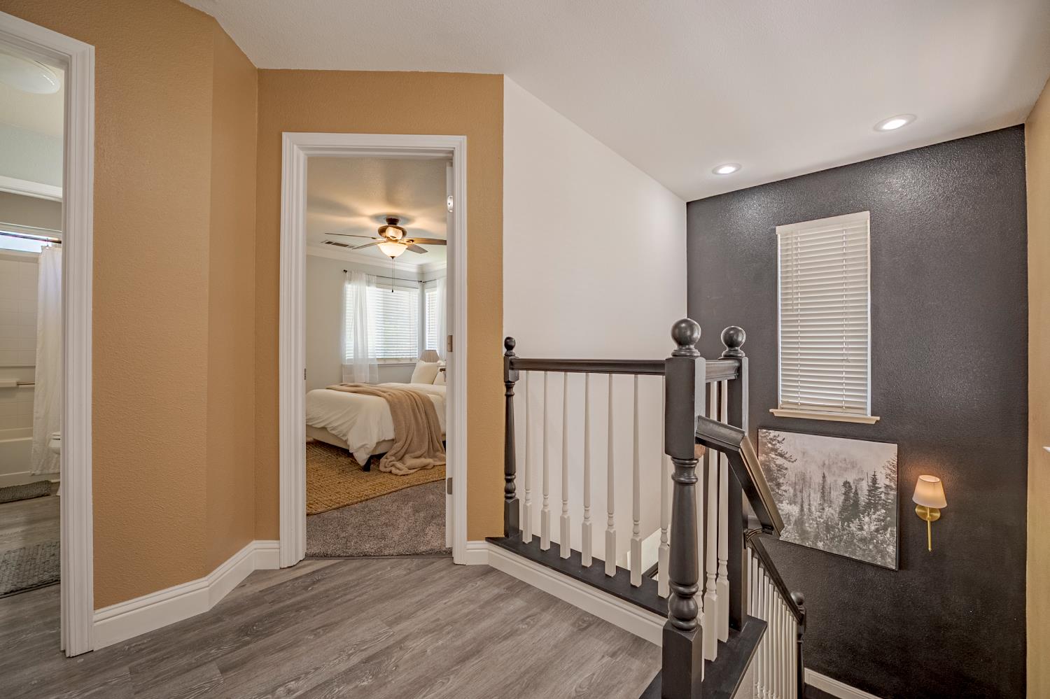 1833 La Quinta Court Merced, CA 95340 - Photo 30 of 55 a view of a hallway to a livingroom with wooden floor and windows