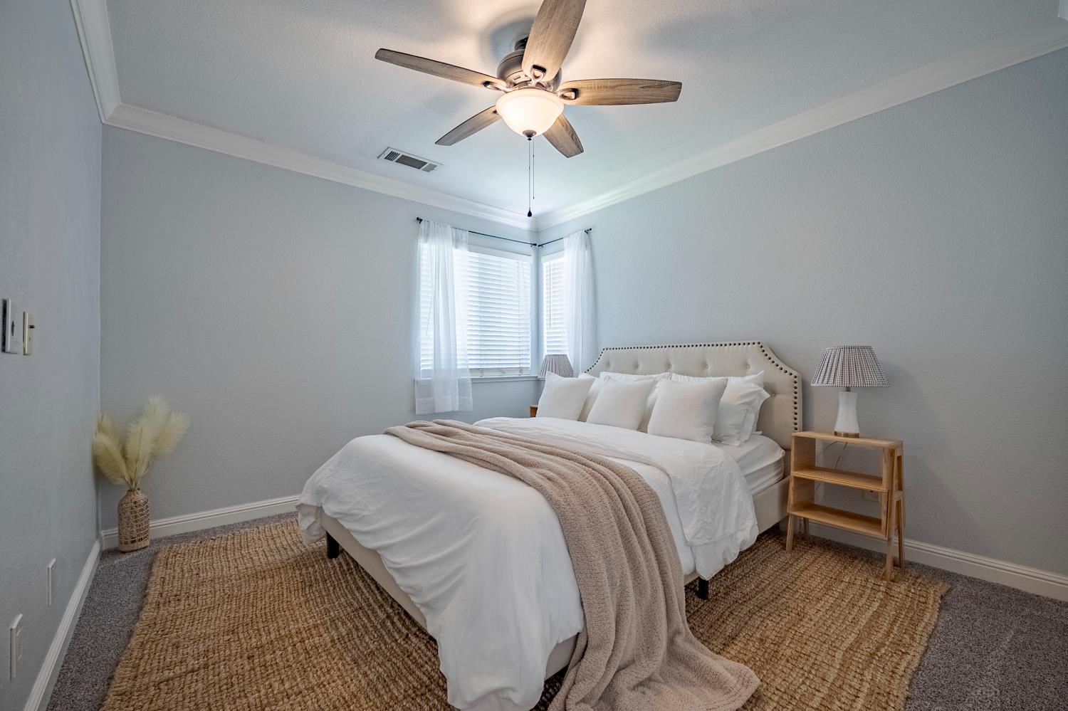 1833 La Quinta Court Merced, CA 95340 - Photo 32 of 55 a bedroom with a bed and a chandelier