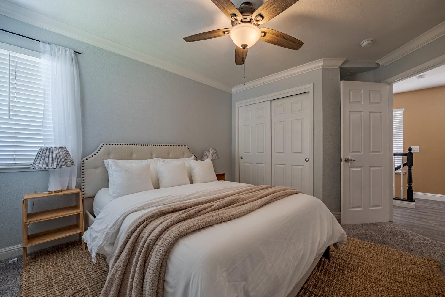 1833 La Quinta Court Merced, CA 95340 - Photo 33 of 55 a bedroom with a bed and a chandelier