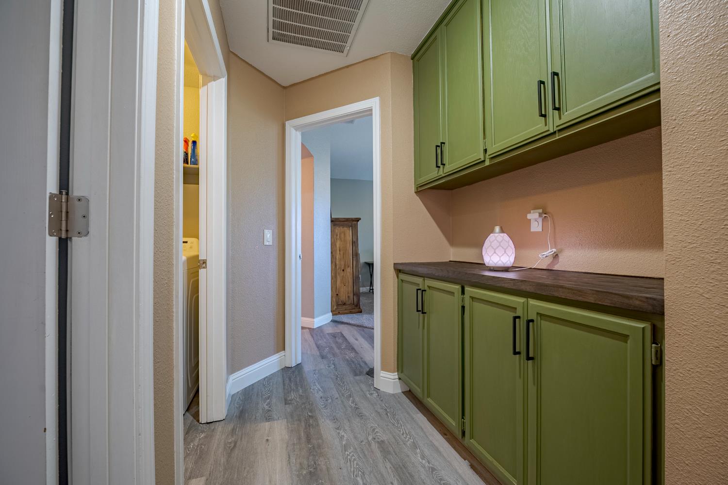 1833 La Quinta Court Merced, CA 95340 - Photo 38 of 55 a kitchen with a refrigerator and washer