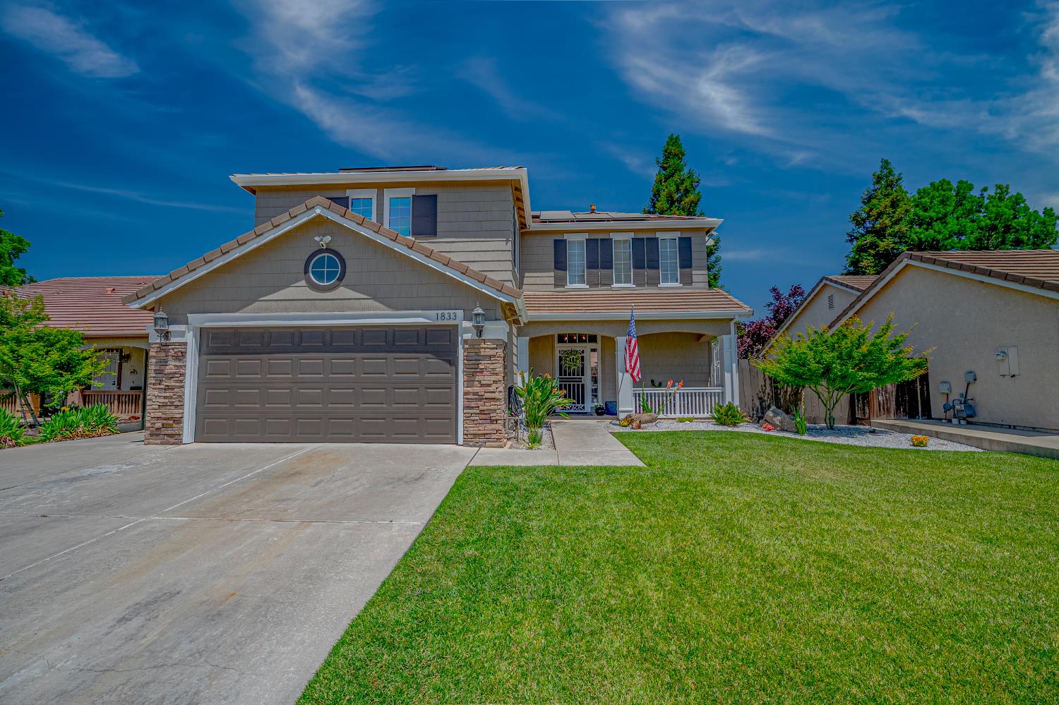 1833 La Quinta Court Merced, CA 95340 - Photo 4 of 55 front view of a house with a yard