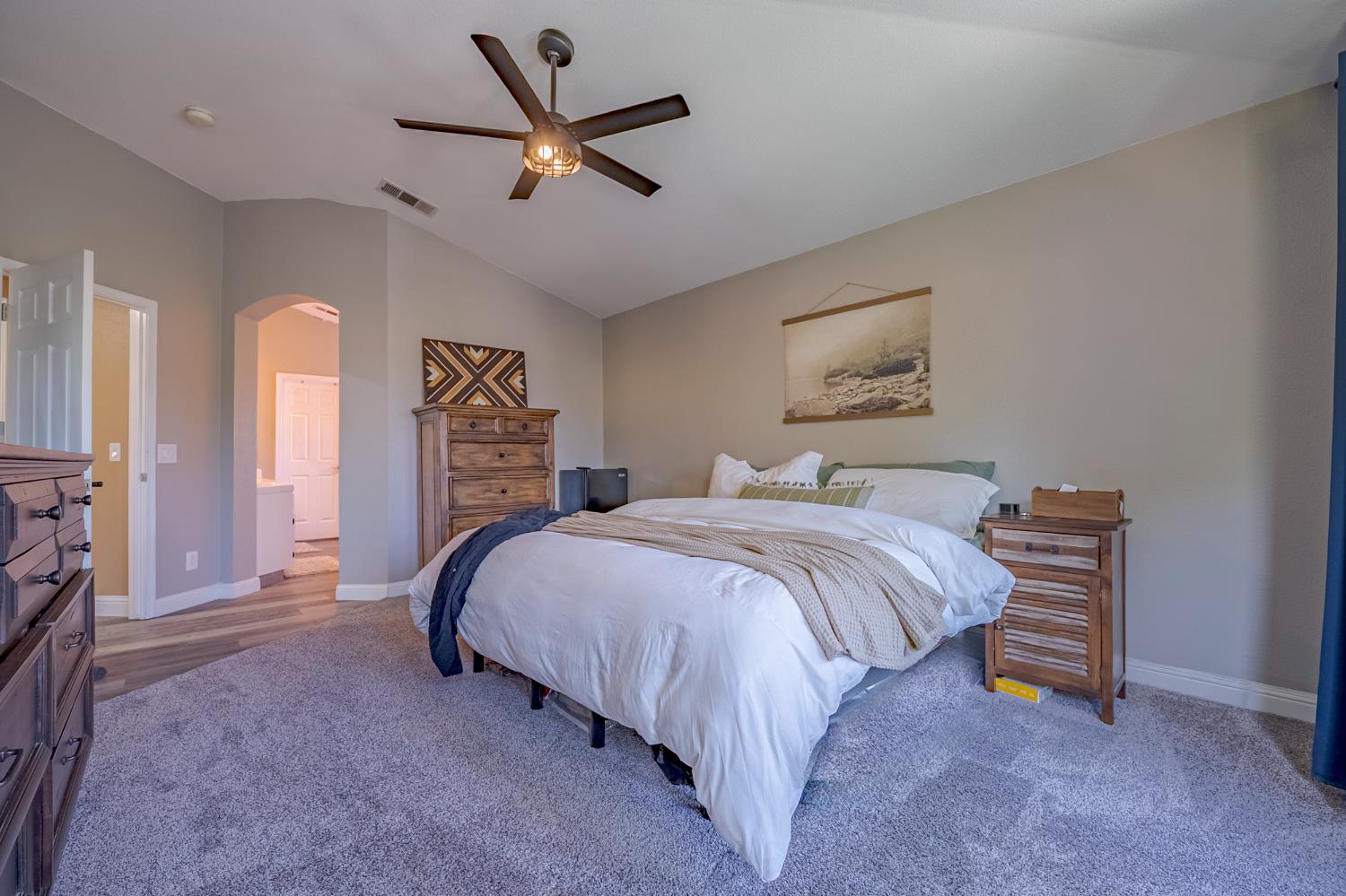 1833 La Quinta Court Merced, CA 95340 - Photo 41 of 55 a bedroom with a bed and a ceiling fan