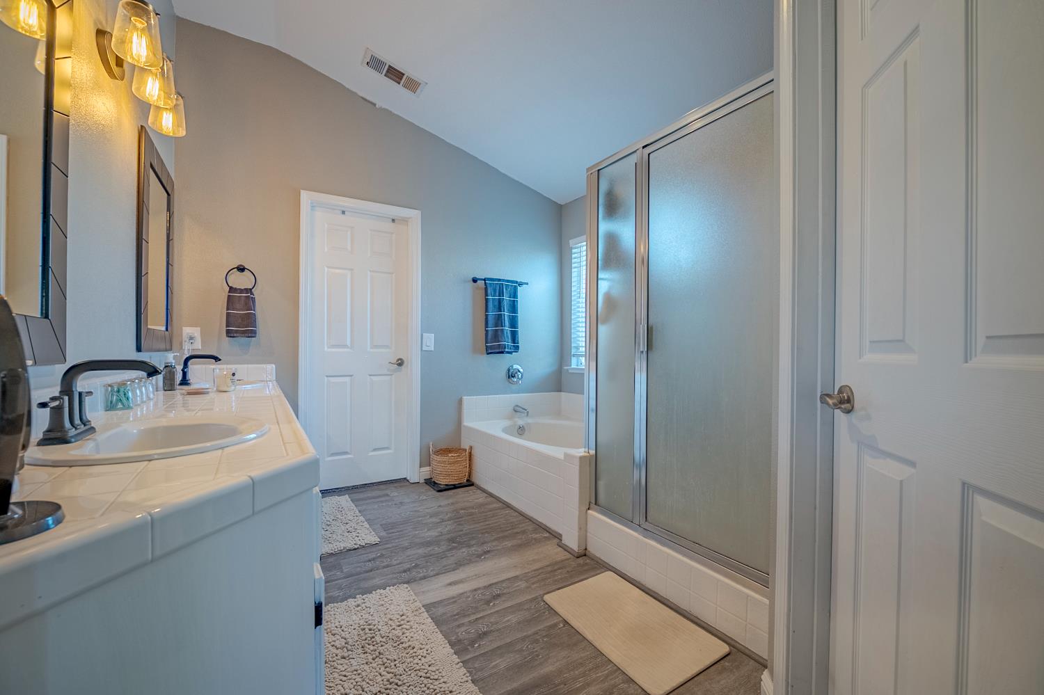 1833 La Quinta Court Merced, CA 95340 - Photo 43 of 55 a bathroom with a sink a toilet and tub