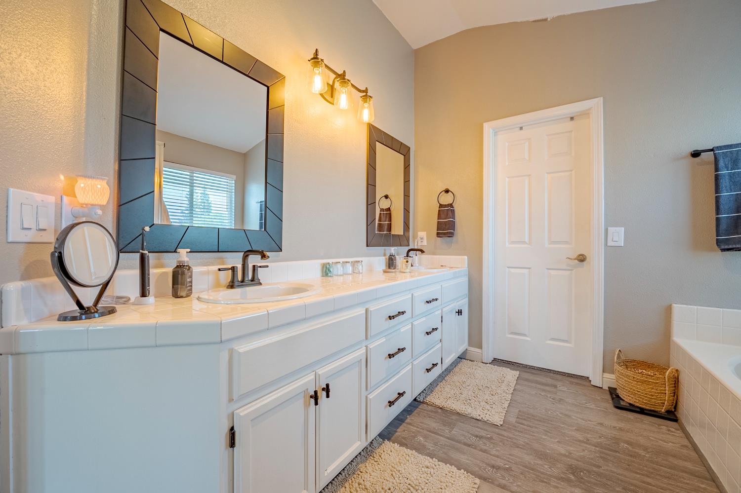 1833 La Quinta Court Merced, CA 95340 - Photo 44 of 55 a bathroom with double vanity sink and a mirror