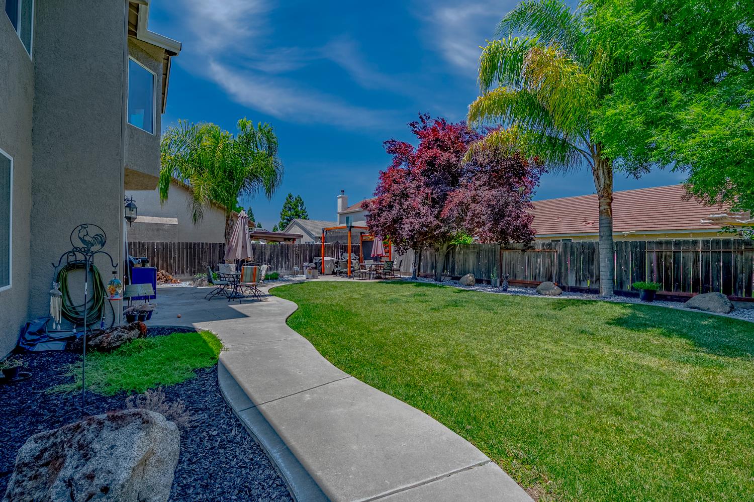 1833 La Quinta Court Merced, CA 95340 - Photo 53 of 55 a view of a garden with a slide