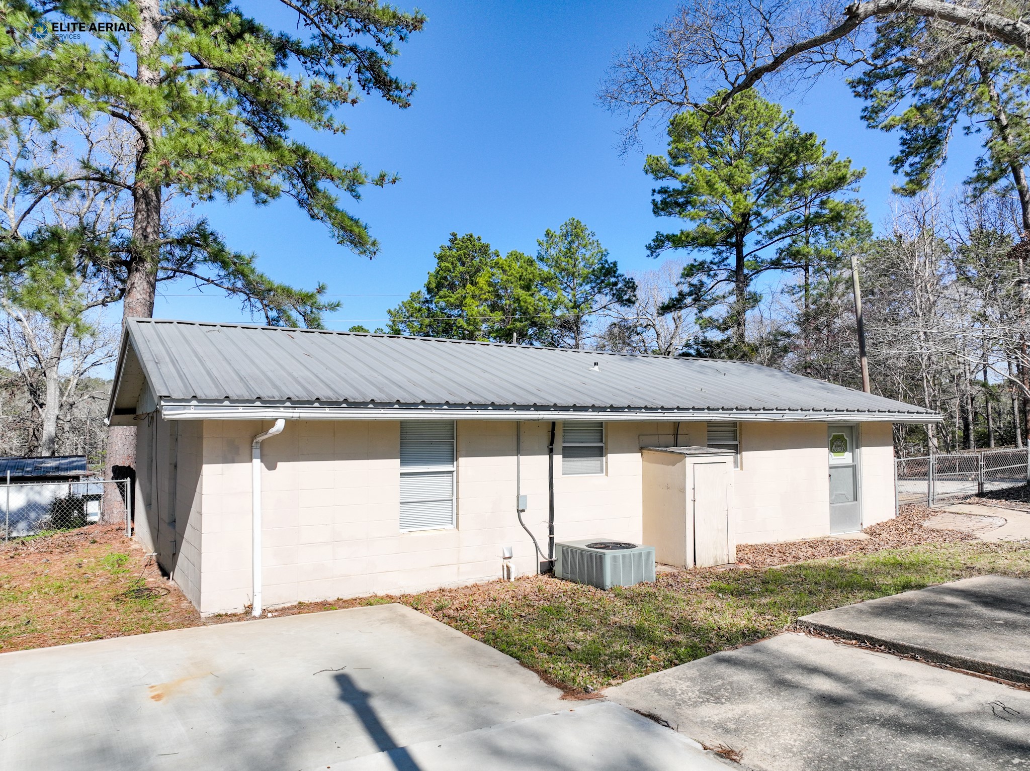 166 County Road 52 Jasper, TX 75951 - Photo 7 of 14 a house with a tree in the background