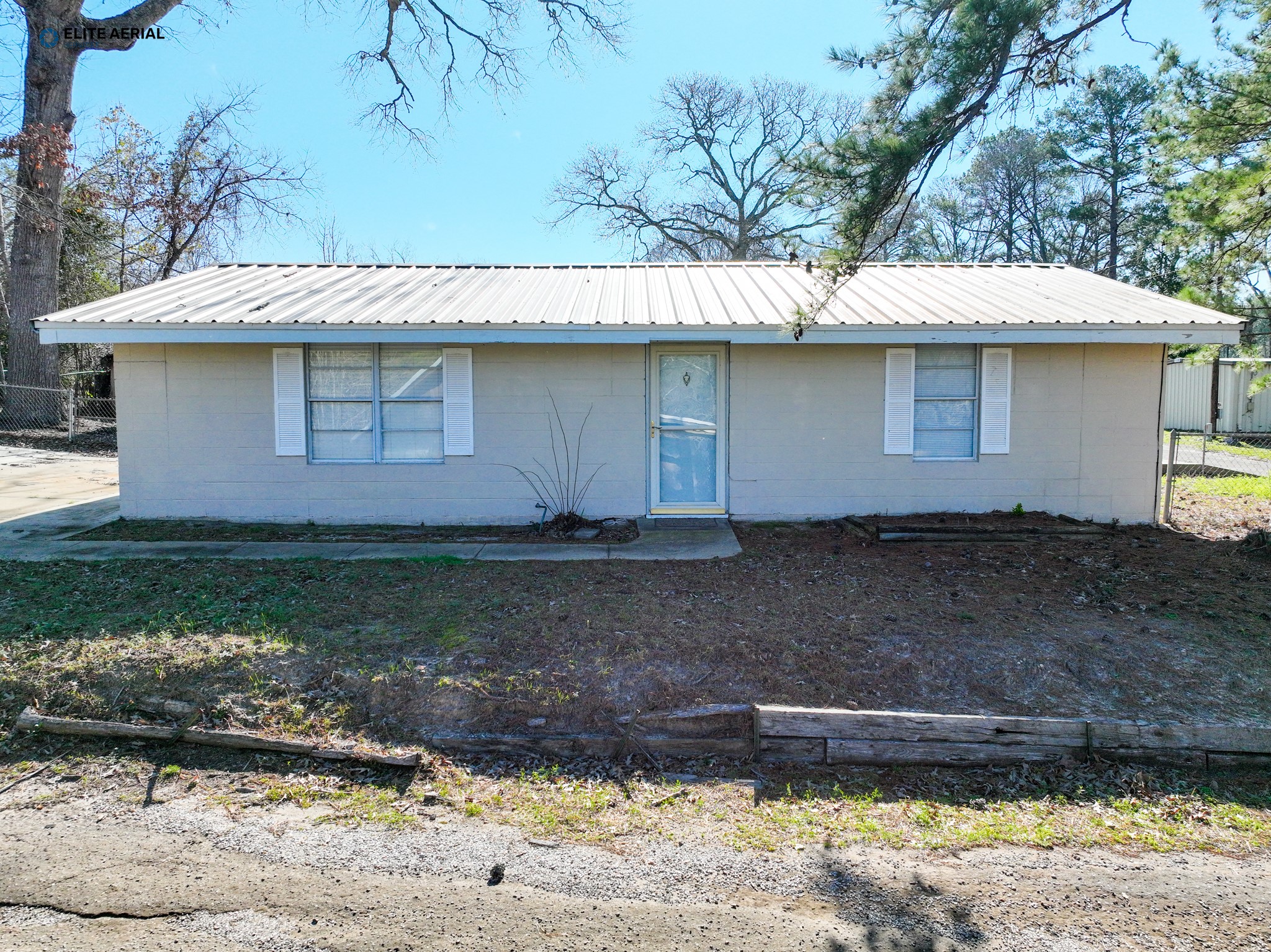 166 County Road 52 Jasper, TX 75951 - Photo 8 of 14 a front view of a house with a yard