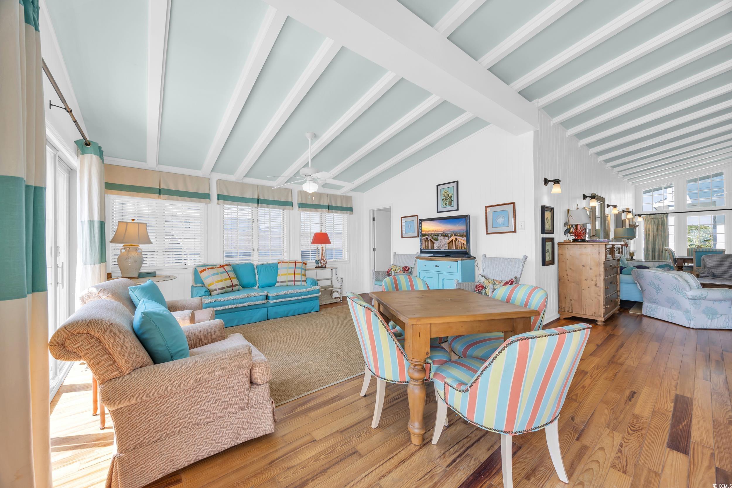 471 Norris Drive Pawleys Island, SC 29585 - Photo 14 of 40 Dining area featuring beam ceiling, wood-type flooring, and high vaulted ceiling