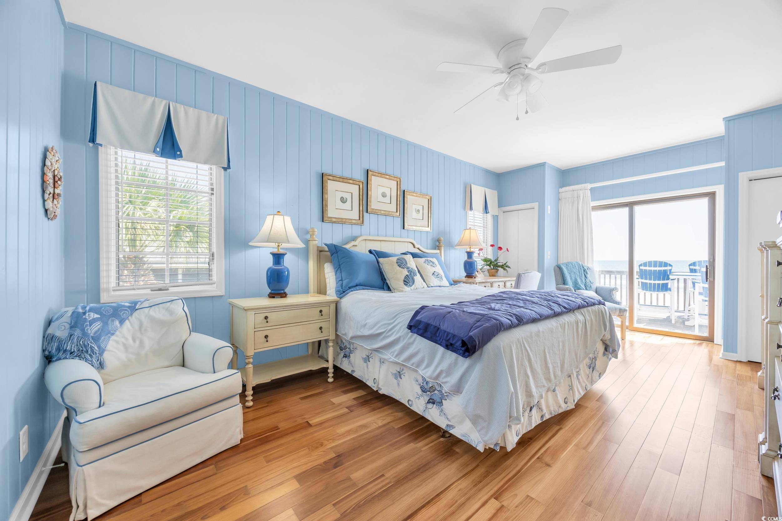 471 Norris Drive Pawleys Island, SC 29585 - Photo 19 of 40 Bedroom with wood finished floors, access to outside, and ceiling fan