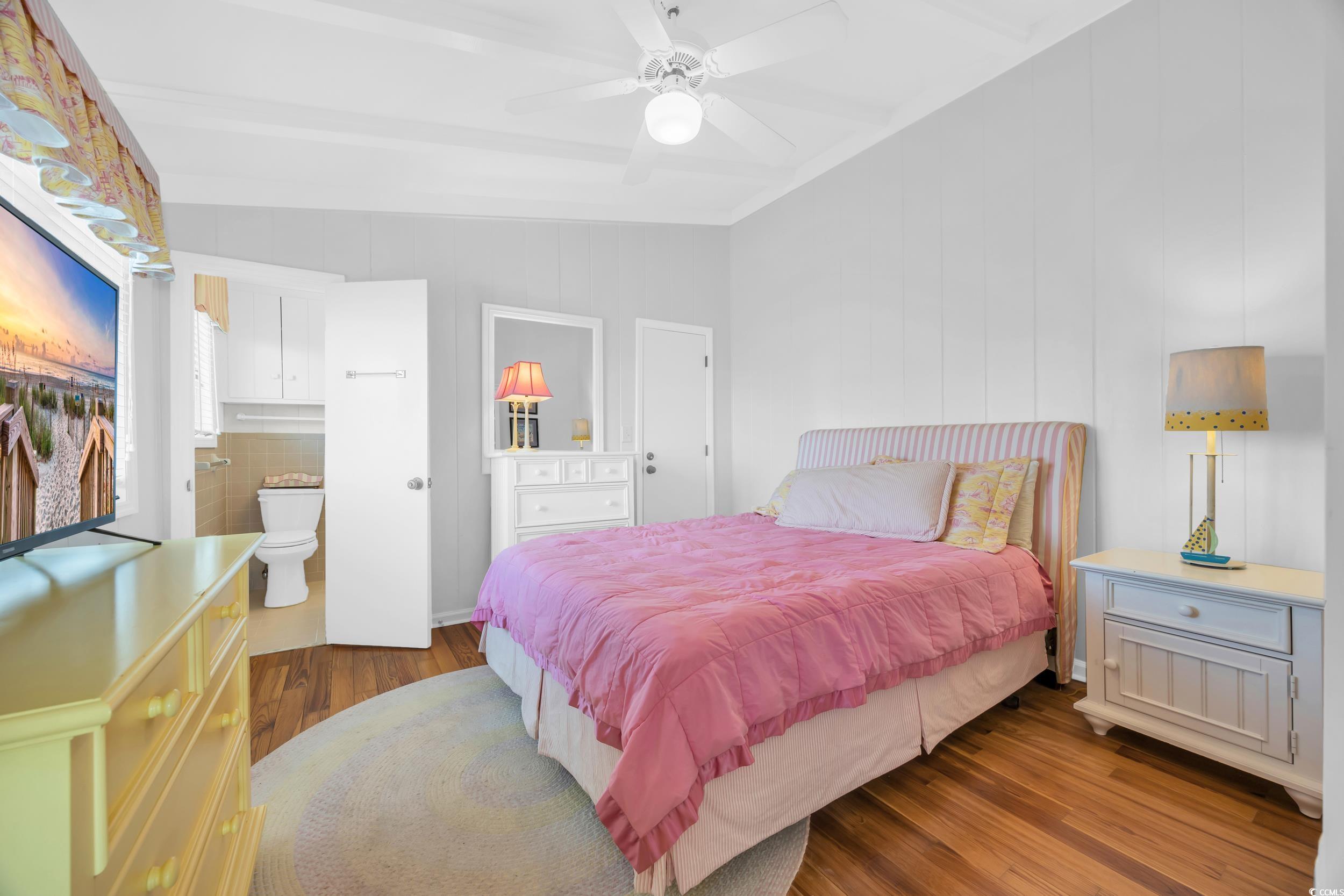 471 Norris Drive Pawleys Island, SC 29585 - Photo 23 of 40 Bedroom featuring wood finished floors, a ceiling fan, and ensuite bath