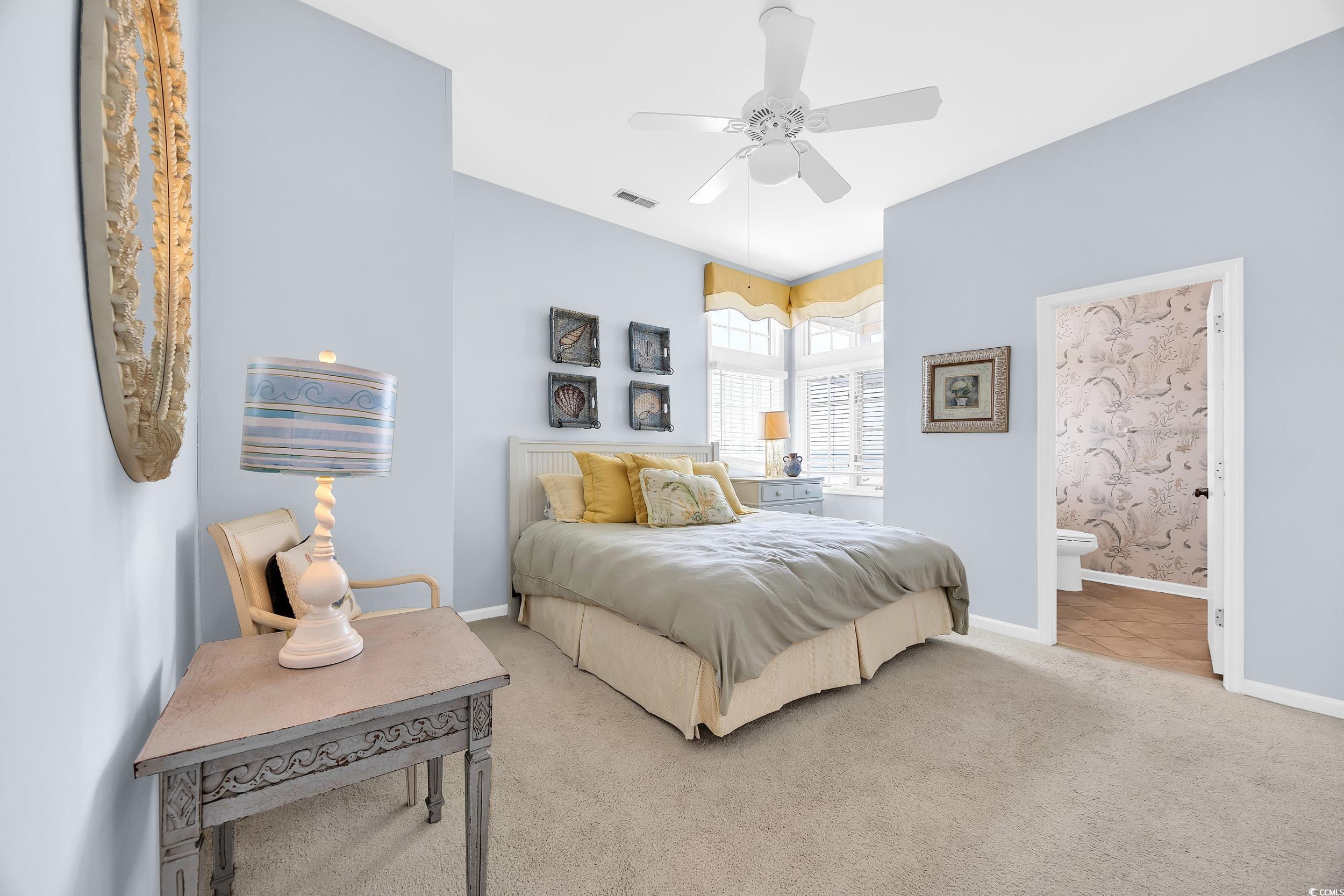471 Norris Drive Pawleys Island, SC 29585 - Photo 26 of 40 Bedroom featuring carpet floors, ceiling fan, and ensuite bath