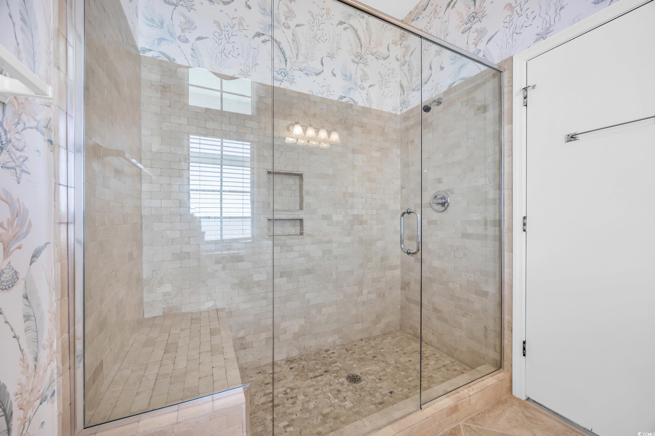 471 Norris Drive Pawleys Island, SC 29585 - Photo 28 of 40 Bathroom with a shower stall, wallpapered walls, and tile patterned floors