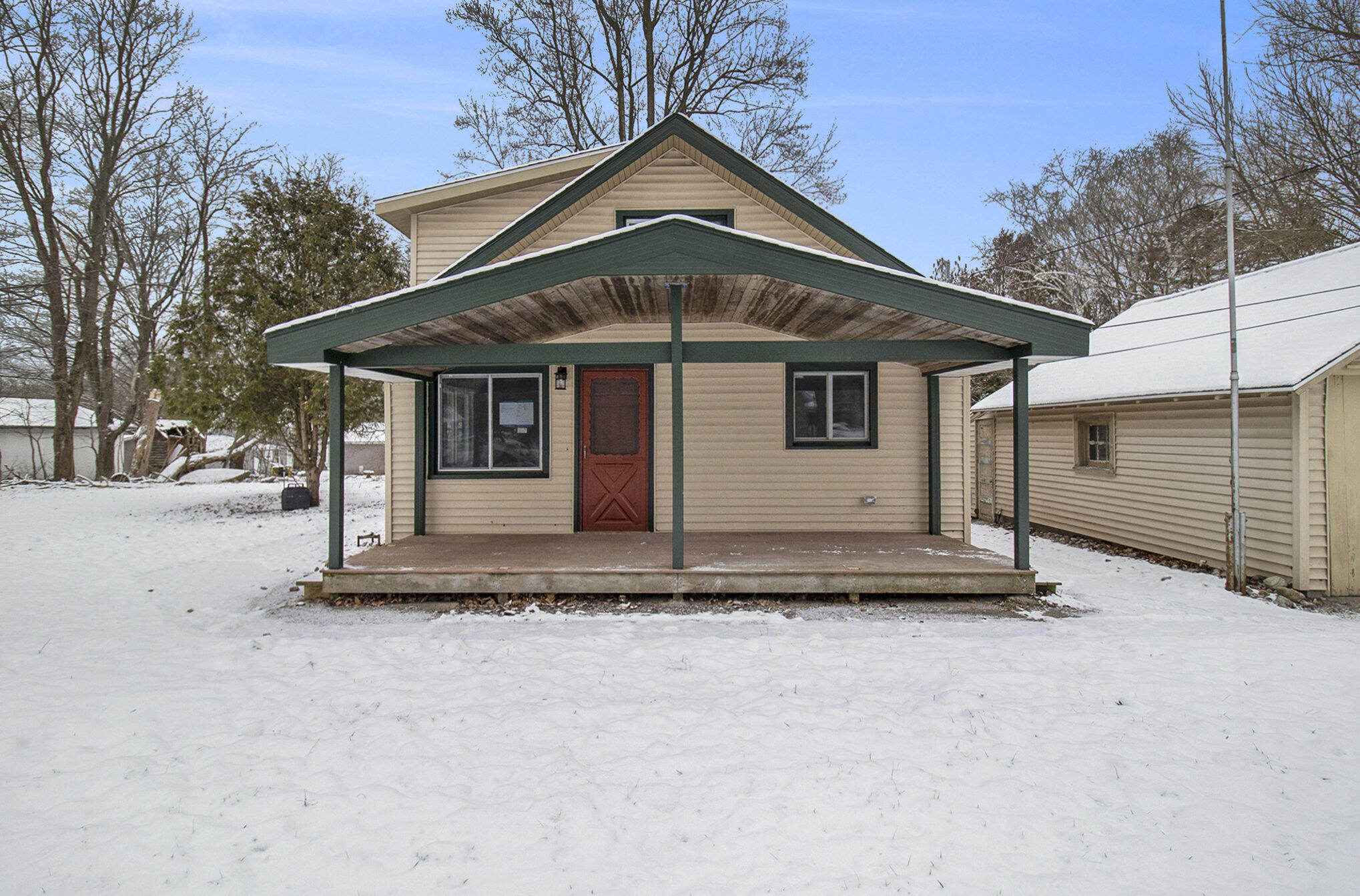 8496 Mill Street Onekama, MI 49675 - Photo 2 of 19 Front of House/ Porch