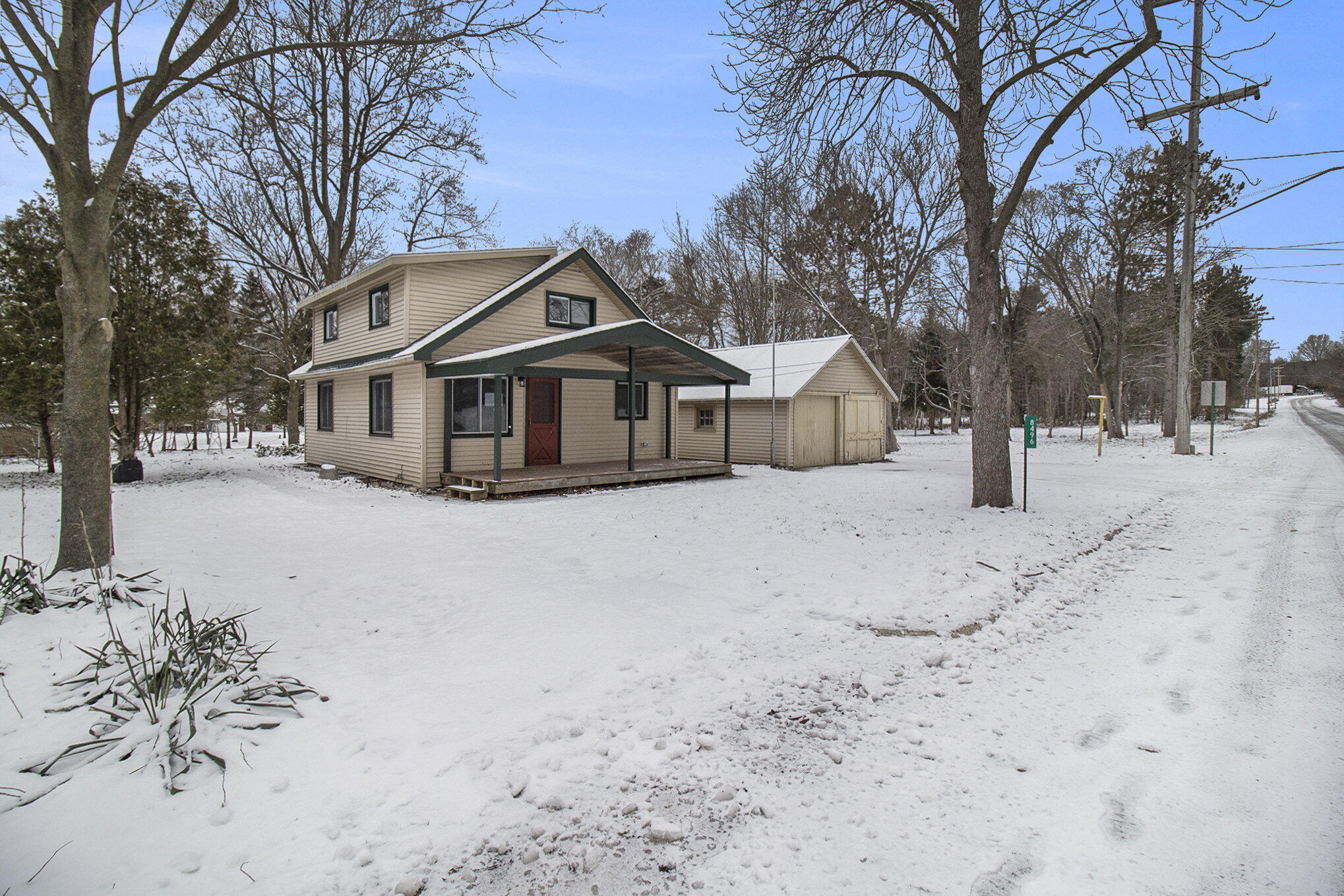 8496 Mill Street Onekama, MI 49675 - Photo 3 of 19 House and garage