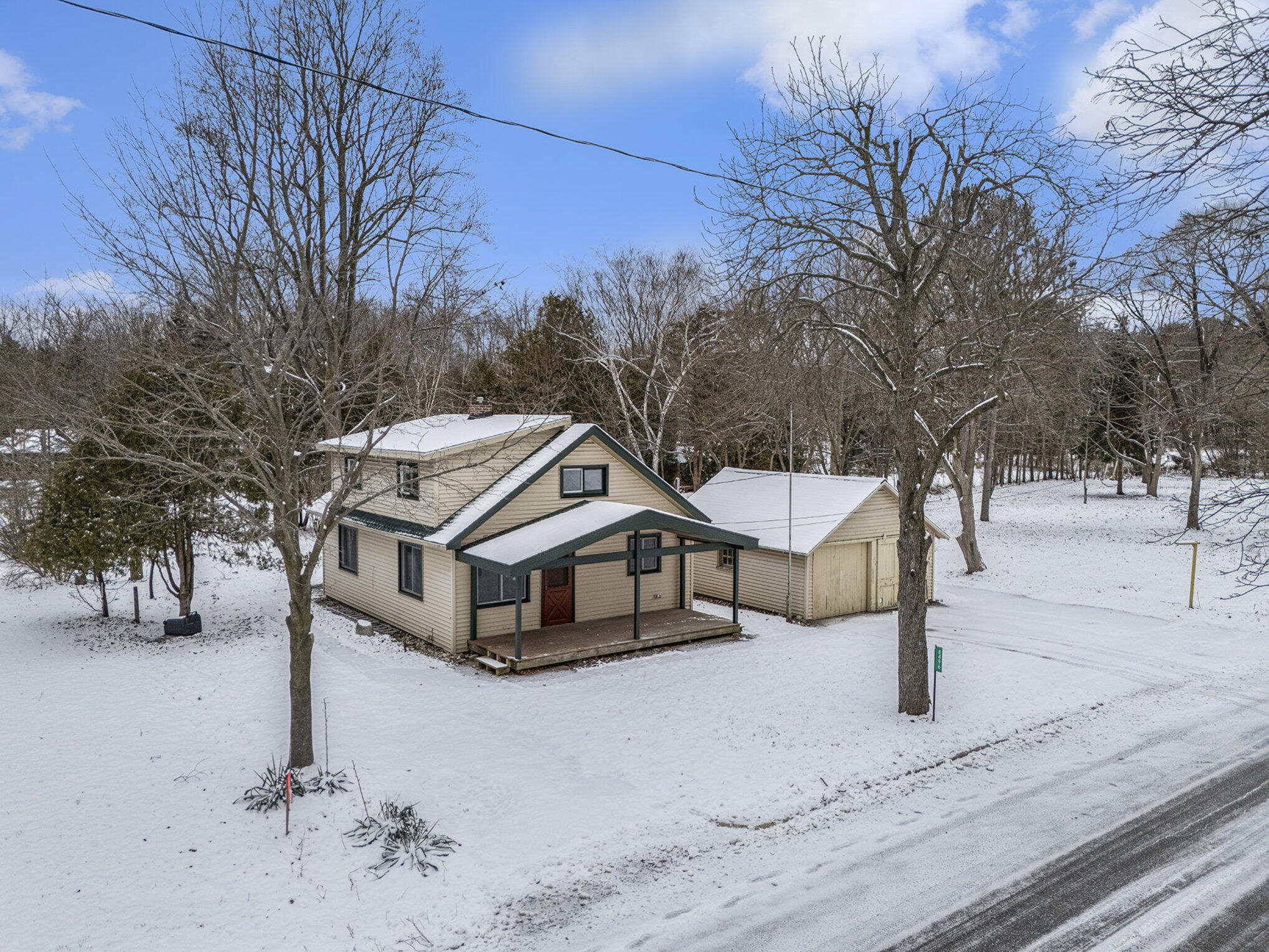 8496 Mill Street Onekama, MI 49675 - Photo 4 of 19 House and garage