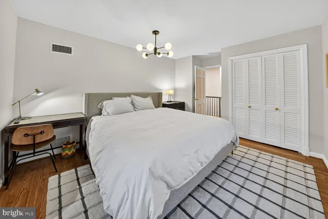 a bed room with a bed and a lamp