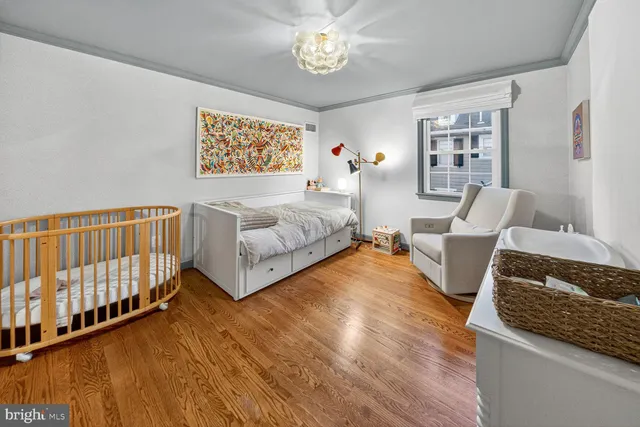 a spacious bedroom with a bed and a couch