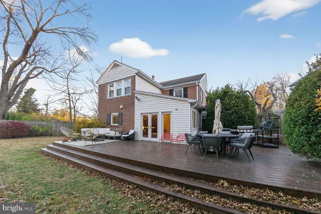 a view of a house with backyard porch and sitting area