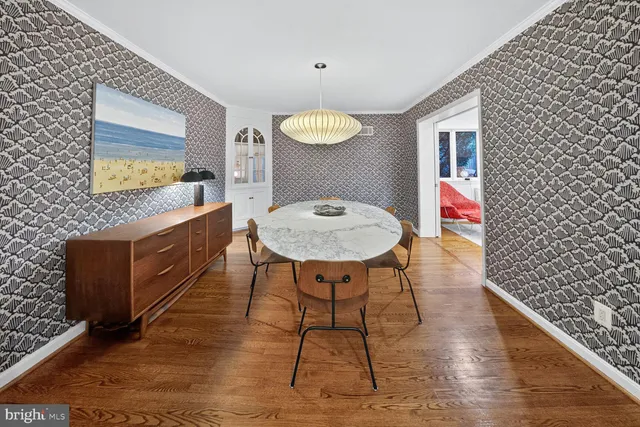 a workspace room with furniture and wooden floor