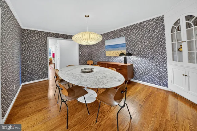 a view of a dining room with furniture and chandelier