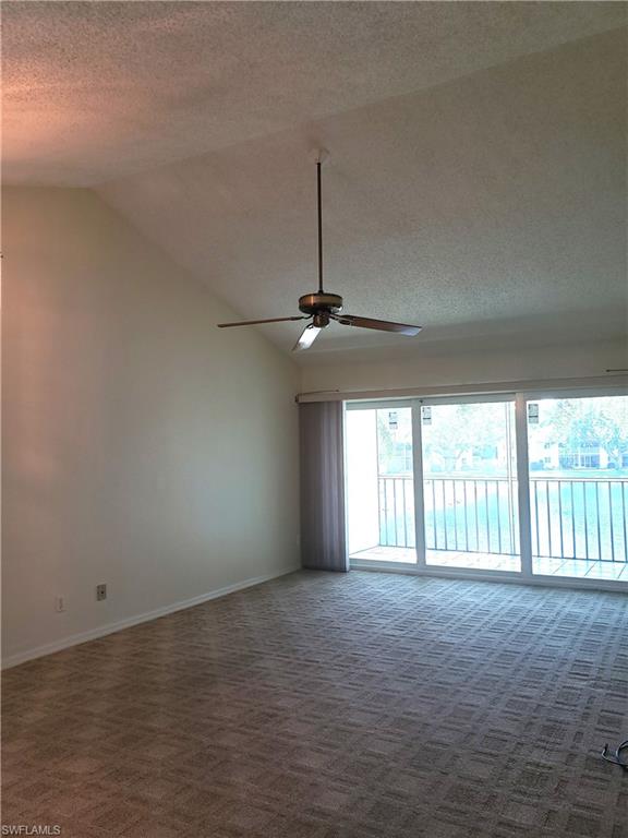 240 Timber Lake Circle, Unit D202 Naples, FL 34104 - Photo 7 of 25 a view of an empty room with a window