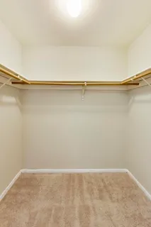 a view of a room with shelf on the wall