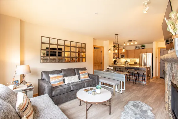 a living room with furniture and a table