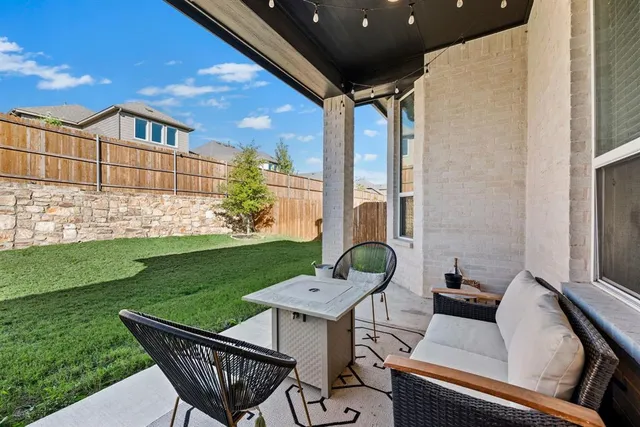 a view of a patio with a yard