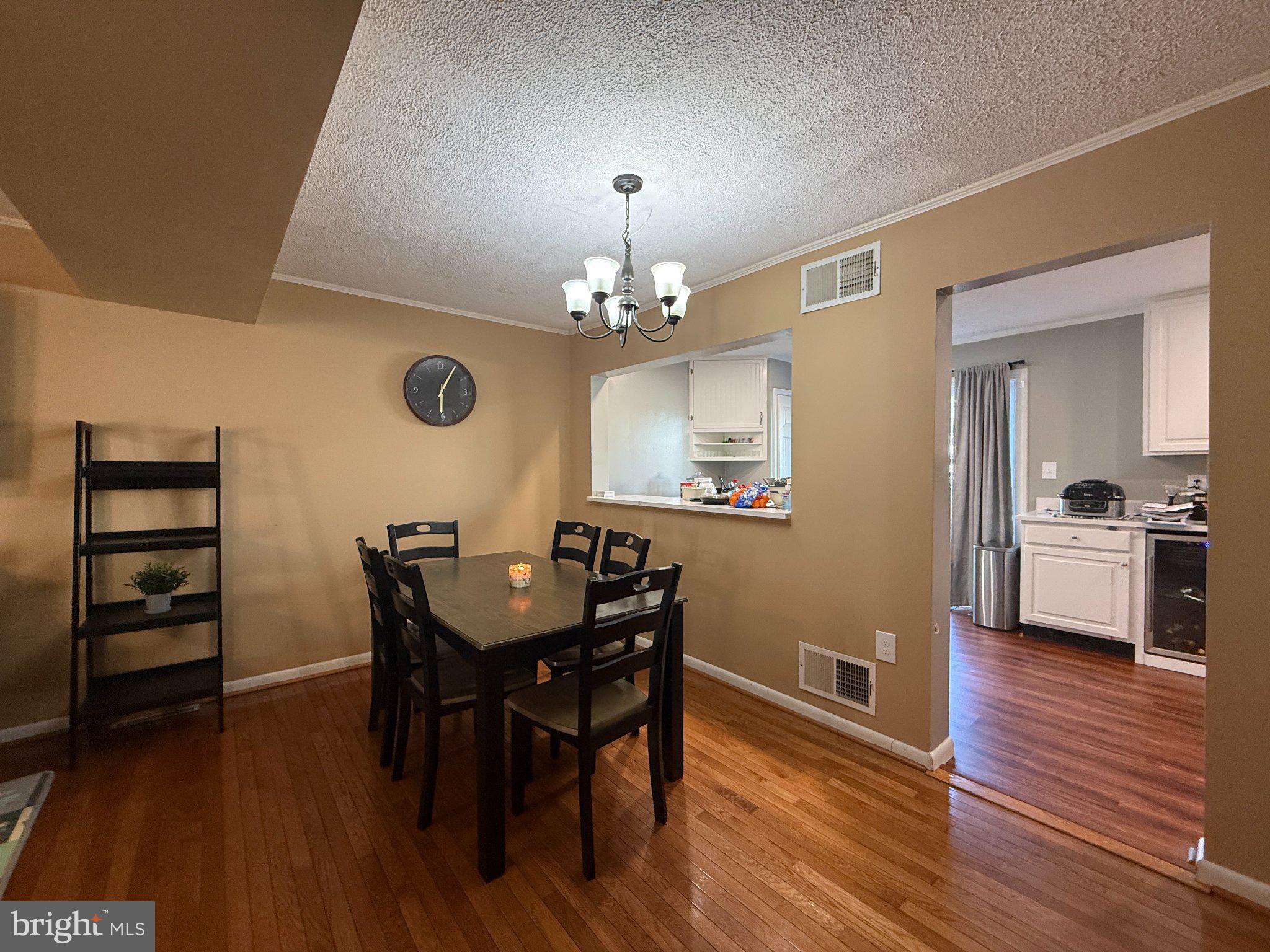 813 Thimbleberry Road, Unit 813 Baltimore, MD 21220 - Photo 7 of 32 Inviting dining space with warm tones.