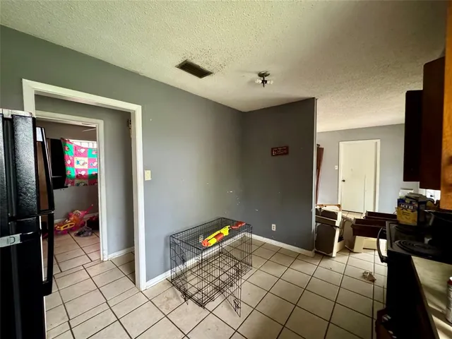 a bedroom with a bed and a chair