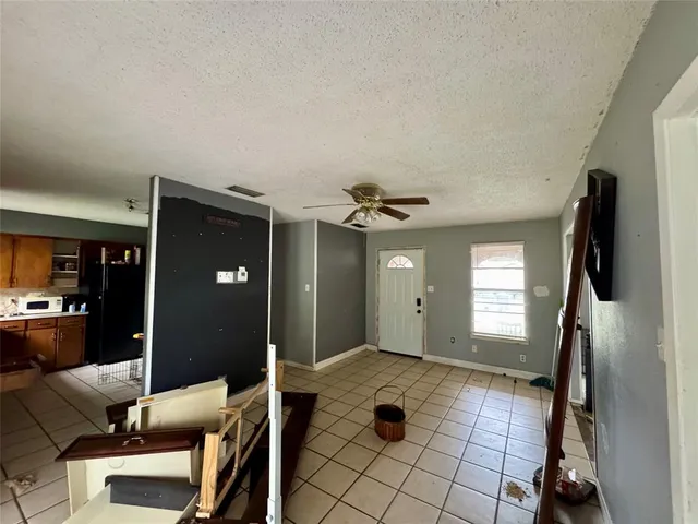 a view of a livingroom with furniture and windows