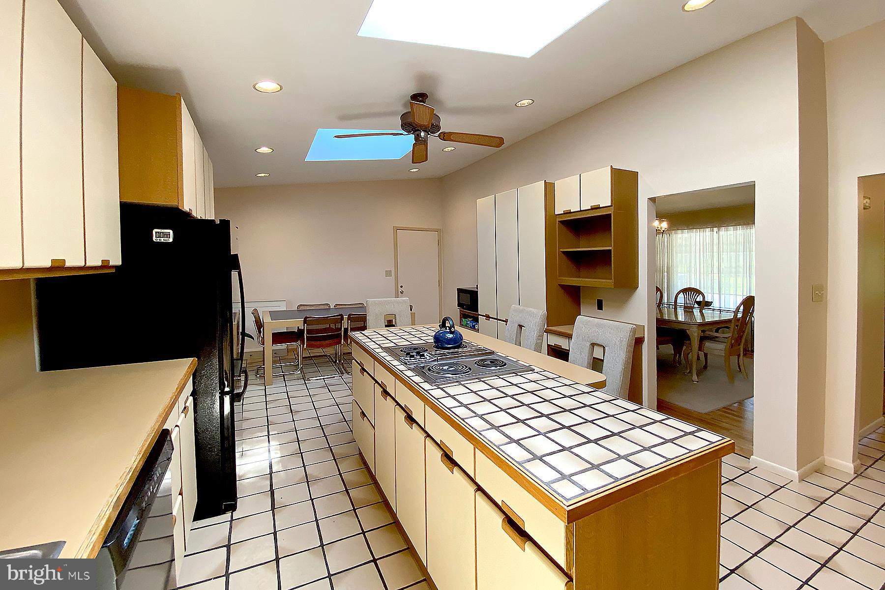 1812 Hopefield Road Silver Spring, MD 20905 - Photo 14 of 37 Kitchen w/ Center Island & Access to Dining Room