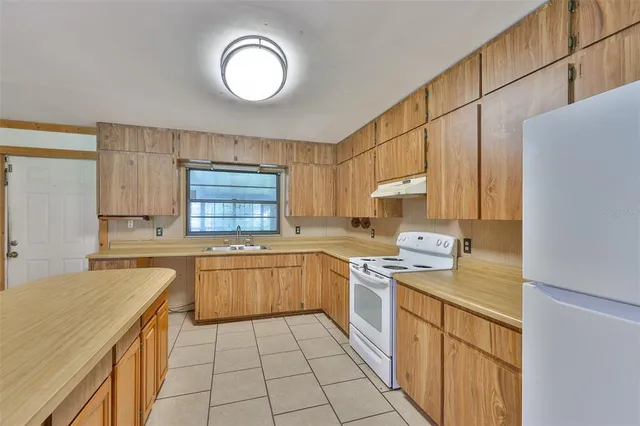 a bathroom with a tub and shower